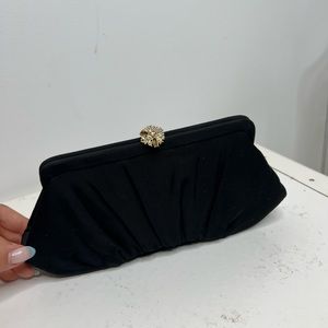 1950s vintage black fabric clutch with satin interior.